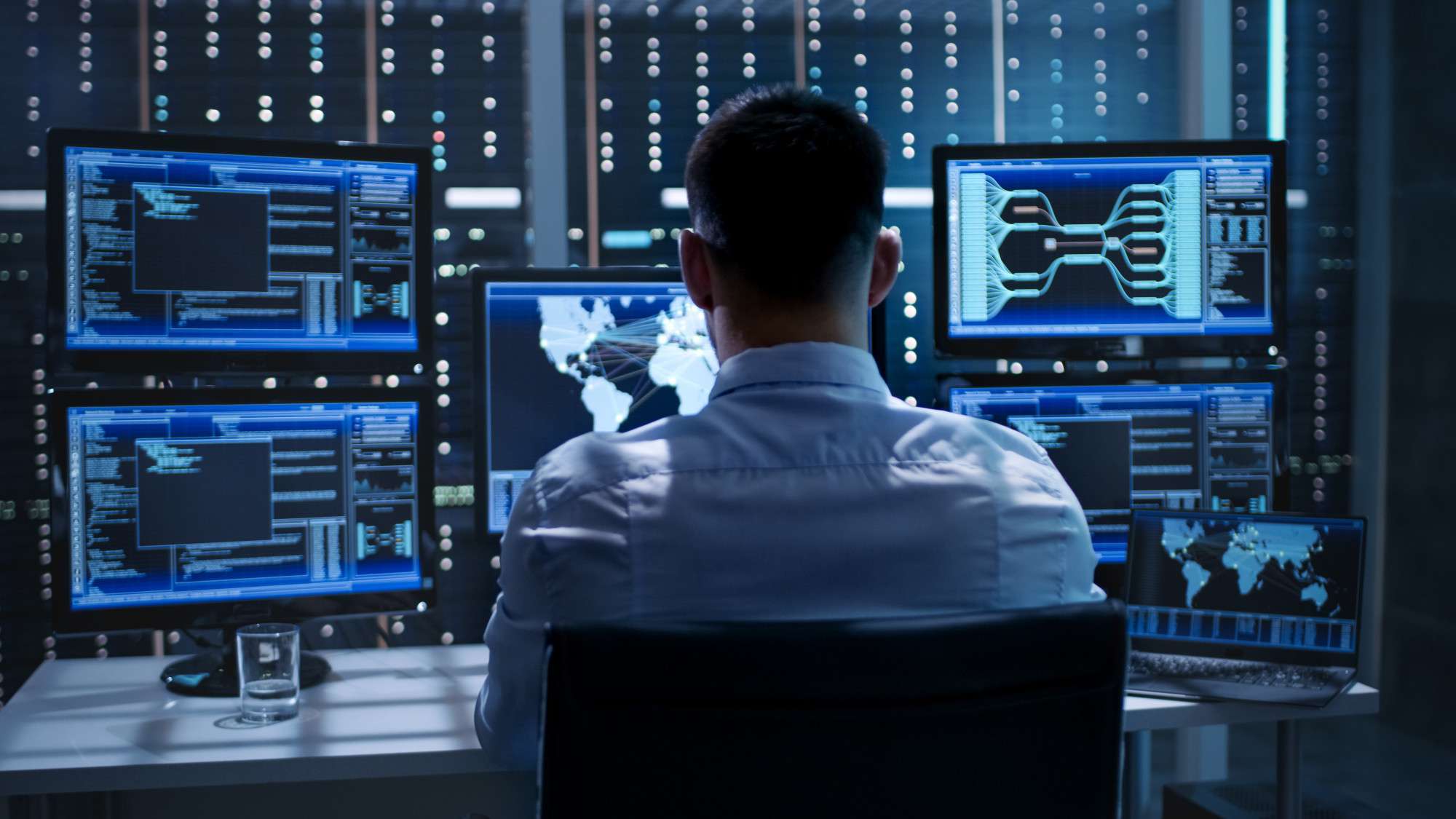 man sitting at computer